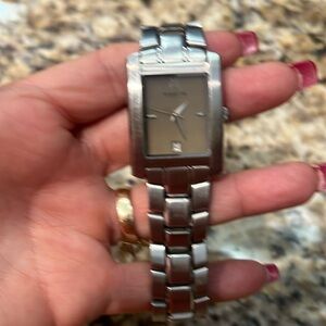 Womens Kenneth Cole silver watch with goldish face GUC